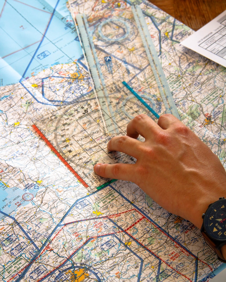 Person drawing on a map