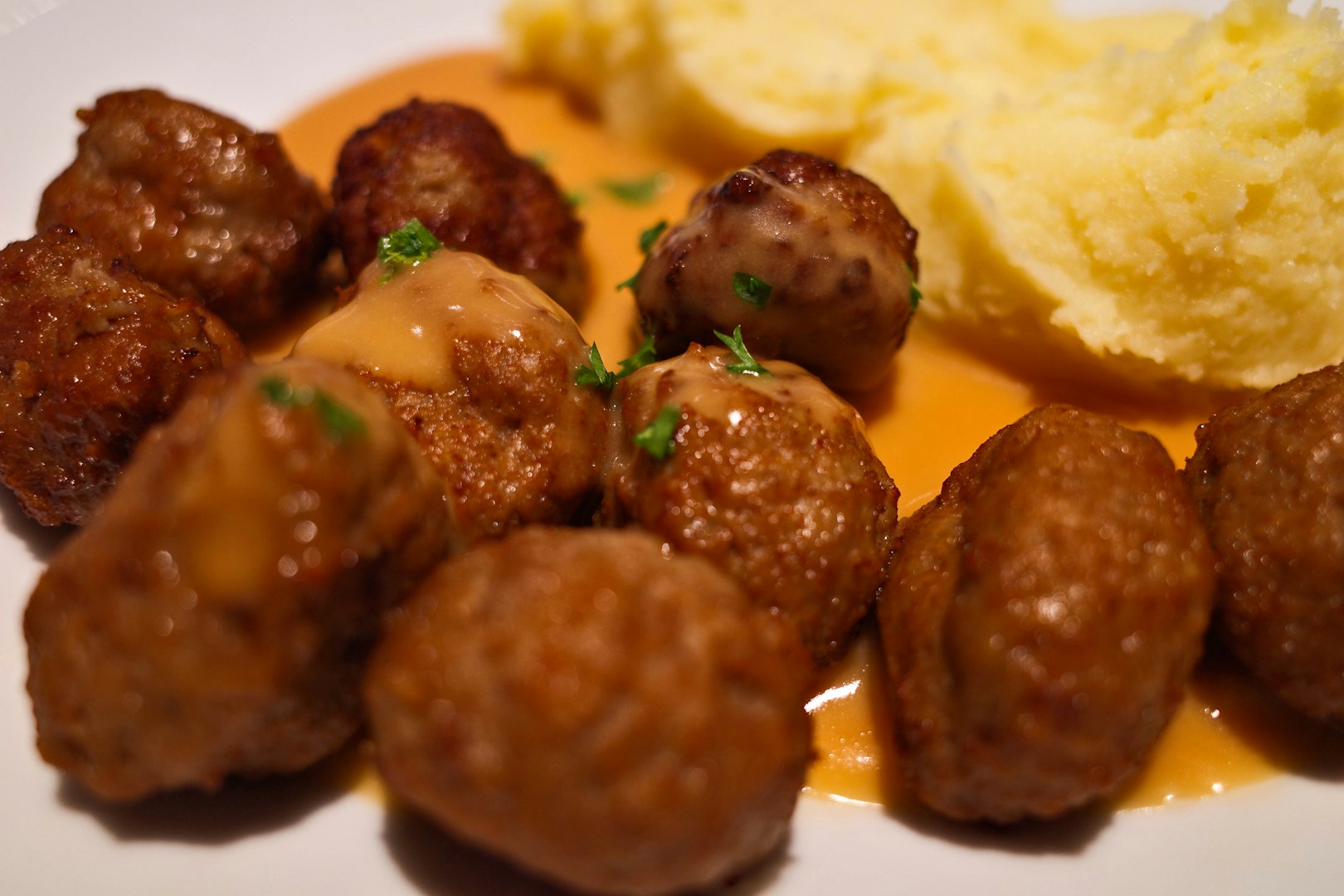 a serving of Swedish-style meatballs with gravy and mashed potatoes