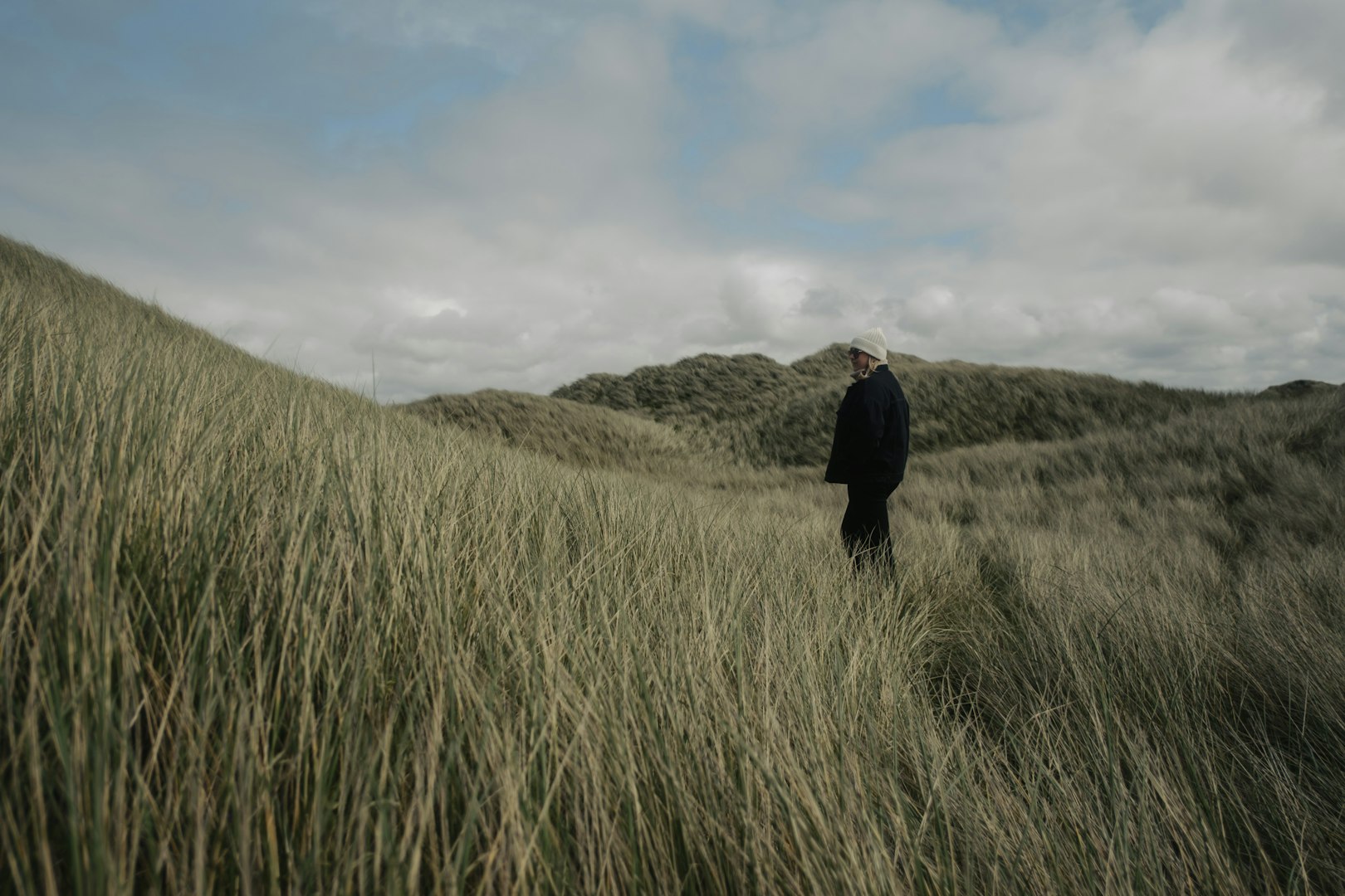 Man walking through field in Danish countryside