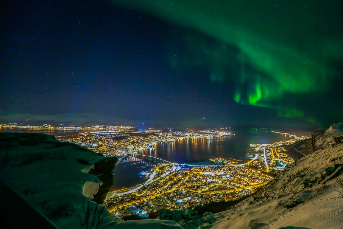 northern lights shine over Tromsø