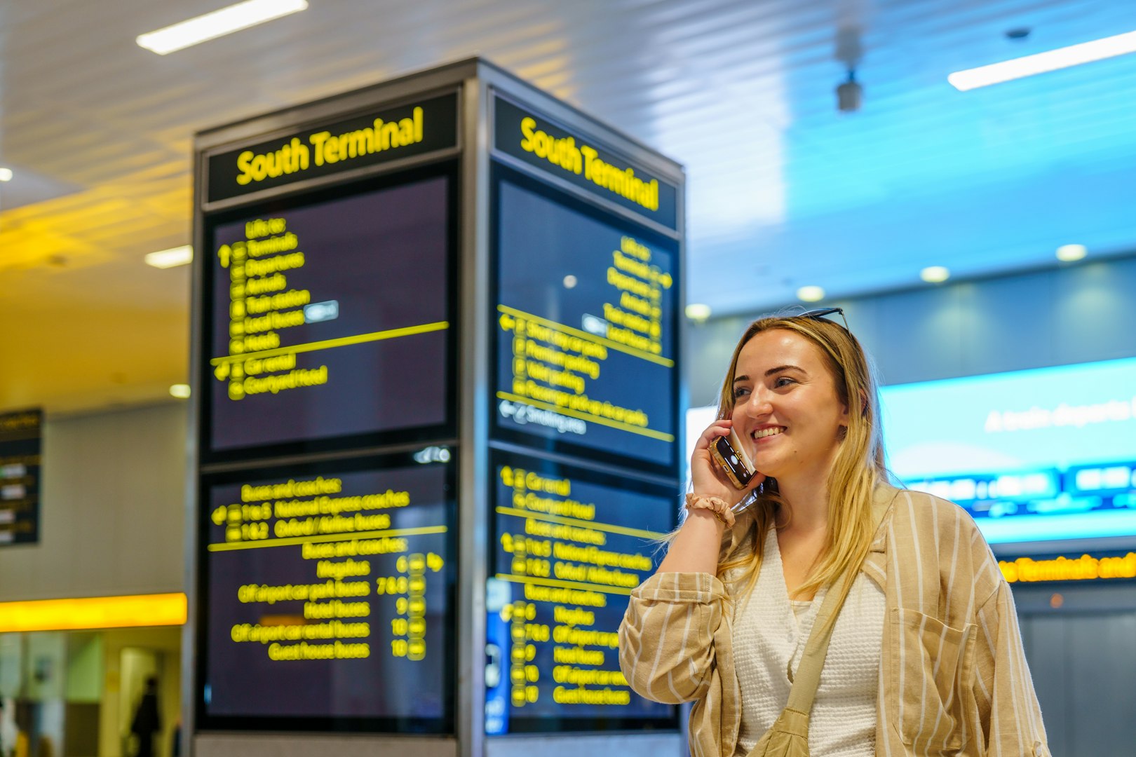 Woman on cellphone at Airport
