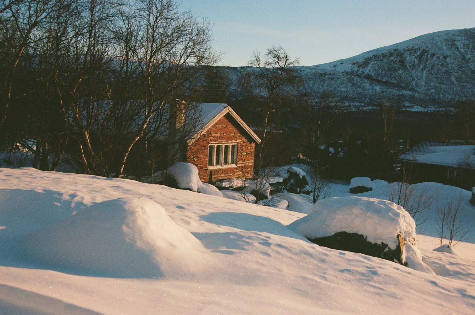 cabin on snowy hillside
